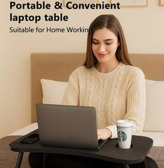 Woman using a portable laptop table in a home setting