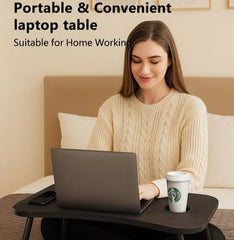 Woman using a portable laptop table in a home setting